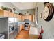 Well-lit kitchen featuring stainless steel appliances and wood cabinets in this condo at 4802 51St W St # 704, Bradenton, FL 34210