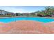 Enjoy this large outdoor pool with a brick patio and ample seating at The Palms of Cortez condos at 4802 51St W St # 704, Bradenton, FL 34210