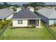 Well-maintained backyard with landscaping, fencing, and a screened-in lanai for outdoor living at 4839 Deep Creek Ter, Parrish, FL 34219