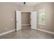 An open bedroom features neutral walls, and tiled floors at 4839 Deep Creek Ter, Parrish, FL 34219