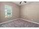 Bedroom featuring neutral paint, carpet, and a window with blinds for privacy at 4839 Deep Creek Ter, Parrish, FL 34219
