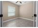 A cozy bedroom features neutral walls and tiled floors at 4839 Deep Creek Ter, Parrish, FL 34219