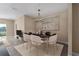 Elegant dining room featuring a modern chandelier and stylish seating, ideal for entertaining at 4839 Deep Creek Ter, Parrish, FL 34219
