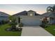 Charming single-Gathering home featuring a two-car garage, well-maintained lawn, and beautiful landscaping at 4839 Deep Creek Ter, Parrish, FL 34219