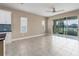 Bright living area showcases an open floor plan with large windows offering serene views at 4839 Deep Creek Ter, Parrish, FL 34219