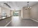 Bright kitchen and living space featuring an open concept, tile flooring, and neutral color scheme at 4839 Deep Creek Ter, Parrish, FL 34219