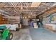 View of the large metal barn, with items stored and high ceilings at 4876 253Rd E St, Myakka City, FL 34251