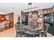Dining room featuring black wood furniture and a rustic, cow-themed wall at 4876 253Rd E St, Myakka City, FL 34251