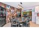 A dining room featuring a dark wood table, chairs, and cow-themed wall decor at 4876 253Rd E St, Myakka City, FL 34251