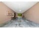 Spacious garage area with ample room for vehicles and storage with view to the back yard at 4876 253Rd E St, Myakka City, FL 34251