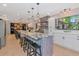 Spacious kitchen with dual islands, stainless appliances, tile floor and white cabinets at 4876 253Rd E St, Myakka City, FL 34251