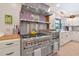Close up shot of a professional grade kitchen stove with stainless steel hood at 4876 253Rd E St, Myakka City, FL 34251