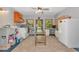 Open laundry room features a sink, washer, a vintage table, and a workstation at 4876 253Rd E St, Myakka City, FL 34251