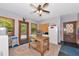 Spacious laundry room with a vintage table, ample natural light, and washer at 4876 253Rd E St, Myakka City, FL 34251