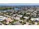 Expansive aerial view of a waterfront community, showcasing canals, homes, and ocean views at 519 74Th St, Holmes Beach, FL 34217