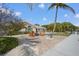 Inviting backyard with brick patio, fire pit, and comfortable seating, perfect for outdoor relaxation and entertainment at 519 74Th St, Holmes Beach, FL 34217