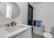 Bright bathroom has a glass enclosed shower with bold accent tile and a modern vanity at 519 74Th St, Holmes Beach, FL 34217