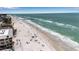 Scenic aerial view of a pristine beach with clear turquoise water, perfect for swimming and sunbathing at 519 74Th St, Holmes Beach, FL 34217