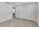 Bright bedroom features modern light gray flooring and a convenient double-door closet at 519 74Th St, Holmes Beach, FL 34217