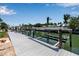 Boat dockage featuring composite decking and boat lift along a waterfront canal at 519 74Th St, Holmes Beach, FL 34217