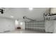 Spacious two car garage with painted walls and ceiling, and overhead door with automatic opener at 519 74Th St, Holmes Beach, FL 34217