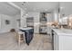 Modern kitchen with a central island, stainless steel appliances, and stylish fixtures at 519 74Th St, Holmes Beach, FL 34217