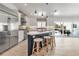 Bright kitchen with an island, stainless steel appliances, and seamless access to the outdoor pool area at 519 74Th St, Holmes Beach, FL 34217