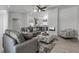 Spacious open-concept living area with a modern fireplace, wood floors, and open kitchen access at 519 74Th St, Holmes Beach, FL 34217