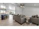 Open-concept living room with wood floors and a view of the pool and kitchen at 519 74Th St, Holmes Beach, FL 34217