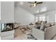 Comfortable living room features a modern fireplace, cozy seating, and lots of natural light at 519 74Th St, Holmes Beach, FL 34217