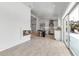 Open concept space featuring modern fireplace, stainless appliances, an island, and sliding doors to outdoor living at 519 74Th St, Holmes Beach, FL 34217