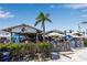 Open-air dining at Ugly Grouper featuring casual seating, a lively atmosphere, and coastal views at 519 74Th St, Holmes Beach, FL 34217