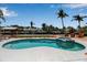 Backyard pool and spa overlooking waterfront boat dockage with lush tropical landscaping at 519 74Th St, Holmes Beach, FL 34217