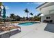 Backyard pool and spa with outdoor seating, tropical landscaping and boat dockage at 519 74Th St, Holmes Beach, FL 34217