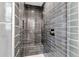Custom shower features gray subway tile, a built-in seat, and contrasting white grout at 519 74Th St, Holmes Beach, FL 34217