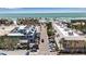 Charming street view with a clear shot of the beautiful beach in the distance, creating a picturesque coastal scene at 519 74Th St, Holmes Beach, FL 34217