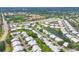 Aerial shot featuring Crestwood Villas, community pool, and surrounding lush greenery in a desirable neighborhood at 5448 Crestlake Blvd # 158, Sarasota, FL 34233