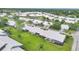 Aerial view of Crestwood Villas showcasing the community's well-maintained landscaping, ponds, and residential areas at 5448 Crestlake Blvd # 158, Sarasota, FL 34233