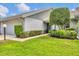 Charming home featuring manicured greenery, adding to its curb appeal and welcoming ambiance at 5448 Crestlake Blvd # 158, Sarasota, FL 34233