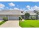 Well-maintained home featuring a pristine lawn, tidy landscaping, and a convenient two-car garage at 5448 Crestlake Blvd # 158, Sarasota, FL 34233