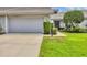 A lovely, well-maintained home featuring a pristine lawn, tidy landscaping, and a two-car garage at 5448 Crestlake Blvd # 158, Sarasota, FL 34233