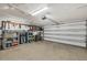Well organized garage with shelving and equipment for storage; bicycles, luggage, tools at 5448 Crestlake Blvd # 158, Sarasota, FL 34233