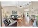 Bright living space featuring hardwood floors, high ceilings, and a seamless flow to the dining area at 5448 Crestlake Blvd # 158, Sarasota, FL 34233