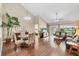 Spacious living area boasts vaulted ceilings, hardwood floors, and sliding glass doors to the outdoors at 5448 Crestlake Blvd # 158, Sarasota, FL 34233