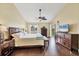 The main bedroom includes wood floors, a ceiling fan, plenty of natural light and ample closet space at 5448 Crestlake Blvd # 158, Sarasota, FL 34233