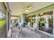 Enjoy the spacious screened-in lanai with a ceiling fan and comfortable seating, perfect for outdoor relaxation at 5448 Crestlake Blvd # 158, Sarasota, FL 34233