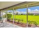 The screened patio provides views of the lush backyard, blending indoor and outdoor living at 5448 Crestlake Blvd # 158, Sarasota, FL 34233