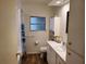Bright bathroom features a single sink vanity and a shower with a curtain at 5536 Denmark Dr, Bradenton, FL 34207