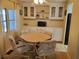 Cozy dining area featuring a round table, comfortable chairs, and a vintage aesthetic at 5536 Denmark Dr, Bradenton, FL 34207