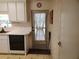 A kitchen featuring modern appliances and ample counter space with a door to outside at 5536 Denmark Dr, Bradenton, FL 34207
